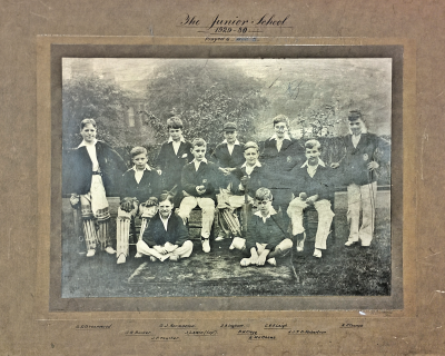Formal photograph showing five players standing behind four seated players with two players sitting cross-legged in front of them