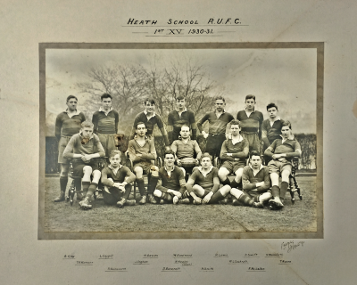 Formal photograph showing seven players standing behind five seated players with four seated cross-legged in front of them