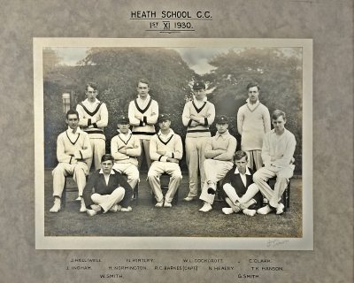 Formal photograph showing four players standing behind five seated players with two players sitting cross-legged in front of them