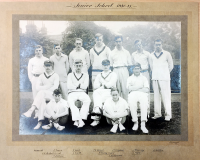 Formal photograph showing seven players standing behind four seated players with two players sitting cross-legged in front of them