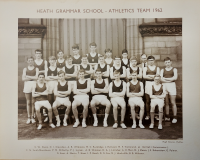 Formal photograph showing a row of six boys standing behind a row of nine boys standing behind a row of seven boys sitting with Mr Birchall standing to the right of the back row
