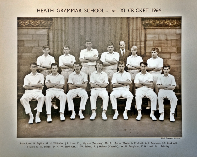 Formal photograph showing thirteen players. six standing and seven sitting, with Mr Evans standing behind the back row