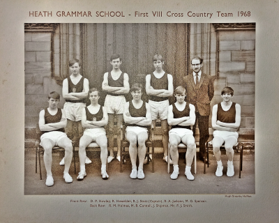 Formal photograph showing three team members with Mr P.J. Smith to their right standing behind five seated team members