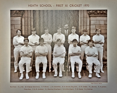 Formal photograph showing twelve players, seven standing and five sitting, with Mr A.K. Barrett standing behind the back row