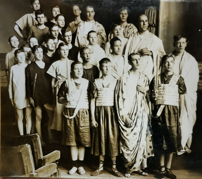 Five rows of the cast of 25