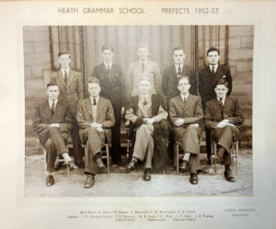 Five 1952/53 prefects standing behind five seated with Mr W.R. Swale in the centre