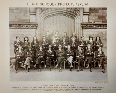 Two rows of 1973/74 prefects standing behind one row seated with Mr Crosby in the middle of the seated row