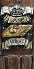 Tank between ‘Tank’ and ‘Corps’ surmounted by a crown