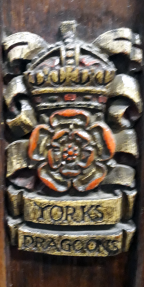 Rose surmounted by a crown and the name underneath