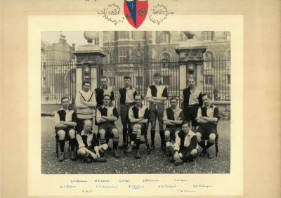 Formal photograph showing five players standing behind five seated players with two players sat crosslegged in the front