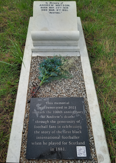 Grave of Andrew Watson with an inscription on a scroll at the head end: In memory of Andrew Watson born May 24th 1856 died Mar 8th 1921. Resting.