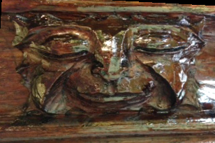 A carving of a face whose eyes have their eyelids closed