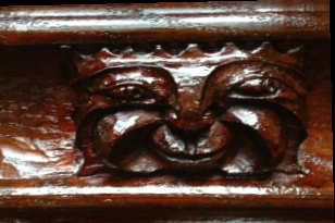A carving of a face whose eyes are open