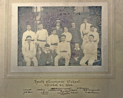 Formal photograph showing three people standing behind five standing players in front of whom are five seated players