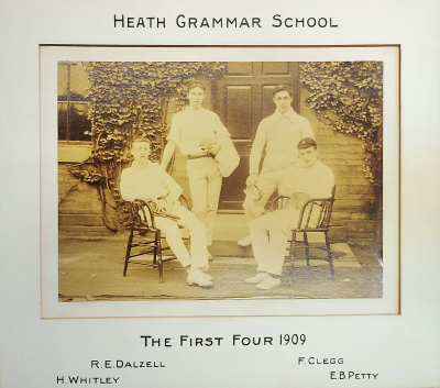 Formal photograph showing two players standing and two players seated