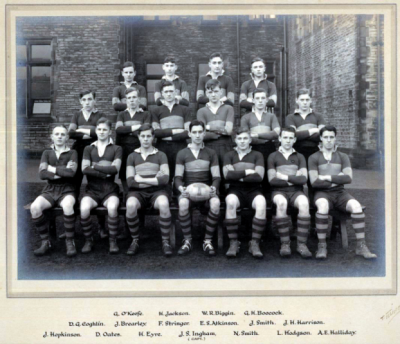 Formal photograph showing seventeen players of the 1933 or 1934 Rugby Team in three rows of seven, six and four from front to back