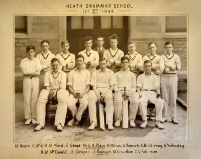 Formal photograph showing thirteen players in two rows of eight standing and five sitting with Mr Place in the middle of the back row