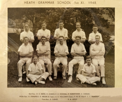 Formal photograph showing twelve players. five standing, five sitting and two sitting crosslegged in the front
