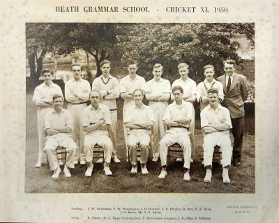 Formal photograph showing eight people standing and five sitting