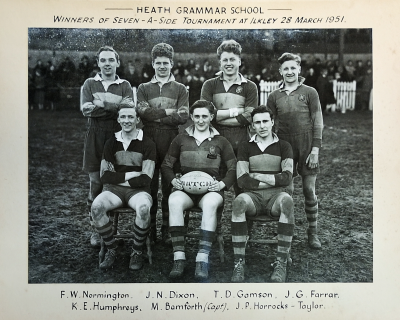 Four players standing behind three seated players