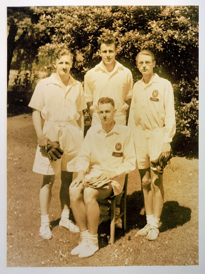 Formal photograph showing three players standing behind one seated player