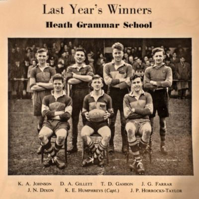 Four players standing behind three seated players