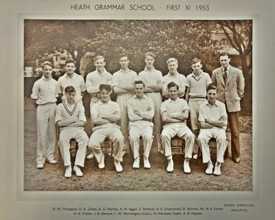Formal photograph showing seven players standing with Mr Carter to their right behind six seated players