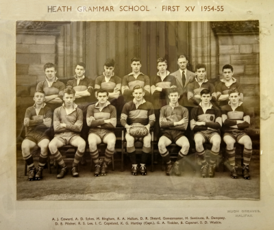 Seven players standing with Mr Birchall three from the right behind seven seated players