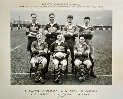 Four players standing behind three seated players