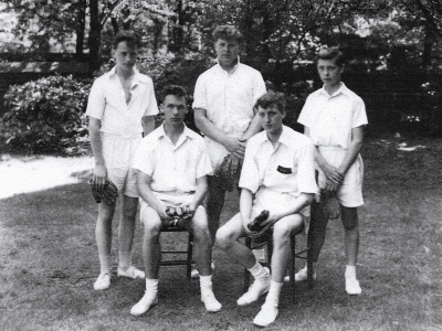 Formal photograph showing two seated and three standing