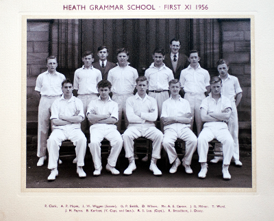 Formal photograph showing eleven players in two rows of five seated and six standing with the scorer and Mr A.E. Carter behind the back row