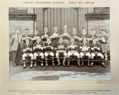 Formal photograph showing nine players standing with Mr Birchall to their left behind seven seated players
