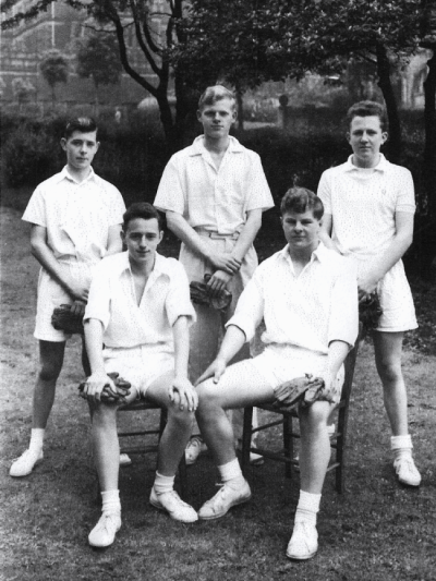 Formal photograph showing two seated and three standing