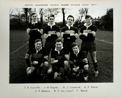 Four players standing behind three players crouching