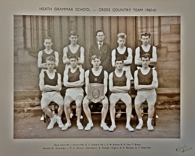 Formal photograph showing four players standing with Mr Blythe standing in the middle behind five seated players