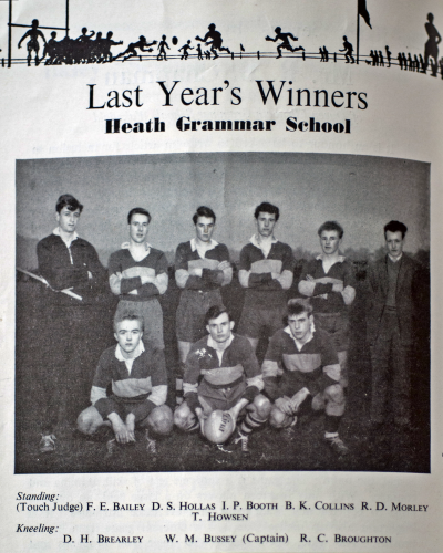 Six players standing behind three crouching players