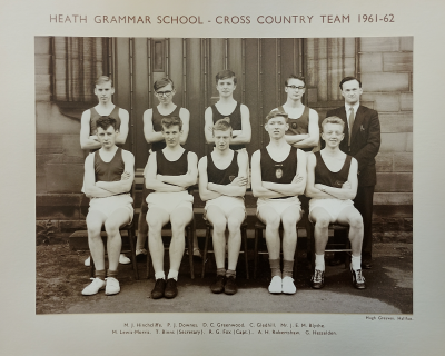 Formal photograph showing four players standing with Mr Blythe standing on their right behind five seated players
