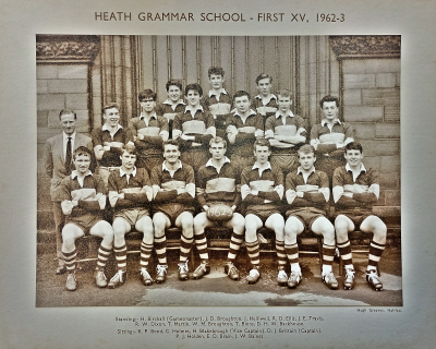 Formal photograph showing three players standing behind six standing players with Mr Birchall standing to their left behind seven seated players