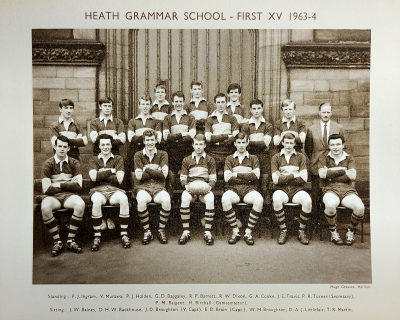 Formal photograph showing three players standing behind seven standing players with Mr Birchall standing to their right behind seven seated players