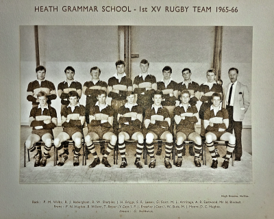 Formal photograph showing eight players standing with Mr Birchall to their right behind seven seated players