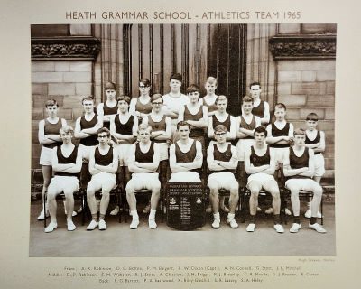 Formal photograph showing five boys standing behind a row of nine boys standing behind a row of seven boys sitting