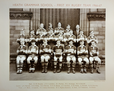 Formal photograph showing four players with Mr Birchall on their right behind eight standing players behind seven seated players