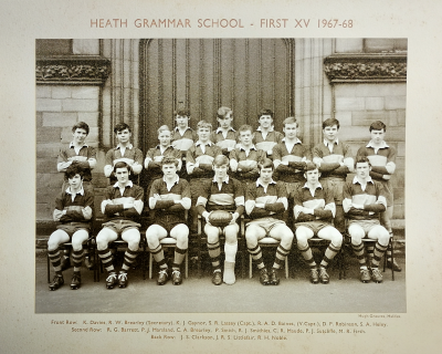 Formal photograph showing three players standing behind eight standing players behind seven seated players