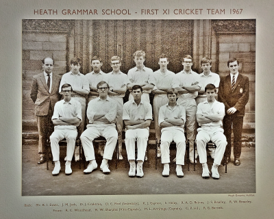 Formal photograph showing seven players standing wth Mr Evams on their left and the scorer on their right behind five seated players