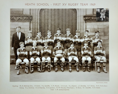 Formal photograph showing eight team members with Mr Bellerby on the left behind eight seated team members