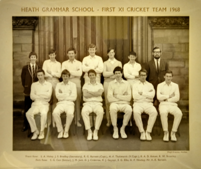Formal photograph showing eleven players, five standing and six sitting, with the scorer standing to the left of the back row and Mr Barnett to the right of the back row