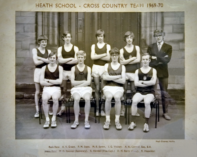Formal photograph showing four team members and Mr D. Lumb standing behind five seated team members