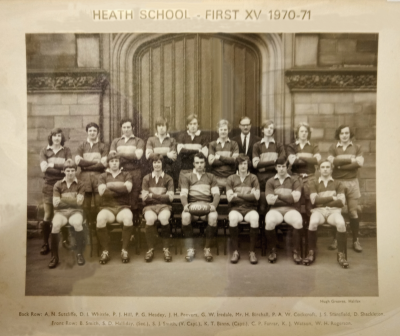 Formal photograph showing eight team members and Mr H. Birchall standing on the front steps of the school behind seven seated team members