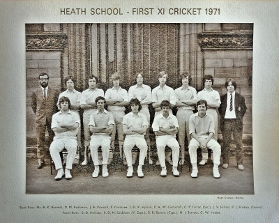Formal photograph showing nine players with Mr Barnett on their left standing behind five seated players