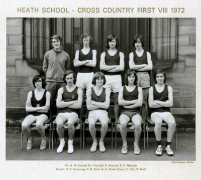 Formal photograph showing Mr A.N. Connell and three team members standing behind five seated team members